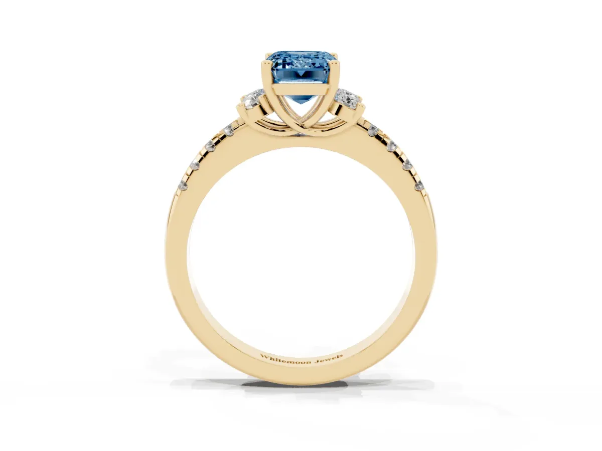 Fancy Blue Emerald Cut Diamond Three-Stone Pave Band with Four-Prong Setting Yellow gold