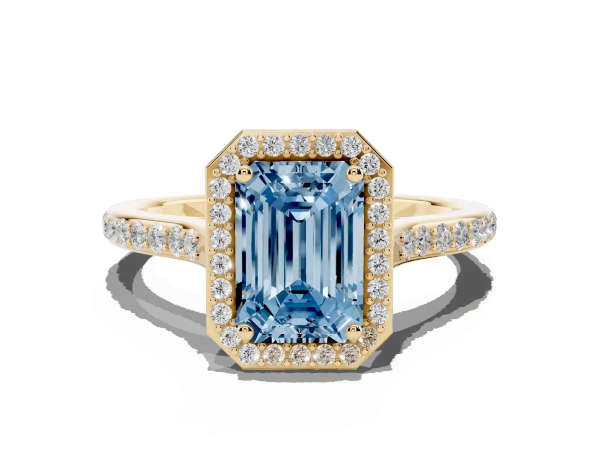 Fancy Blue Emerald Cut Diamond Halo Engagement Ring with Round Pavé Shoulders and Prong Setting Yellow gold