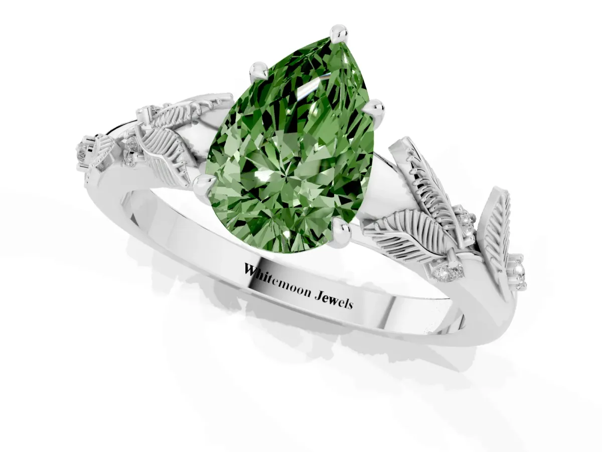 Fancy Green Pear Cut Diamond Solitaire Ring with Leaf Motif Band and Four-Prong Setting Silver