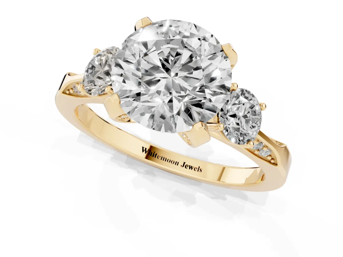 Round Cut Brilliant Three-Stone Diamond Ring with Pavé Band and Four-Prong Setting Yellow gold
