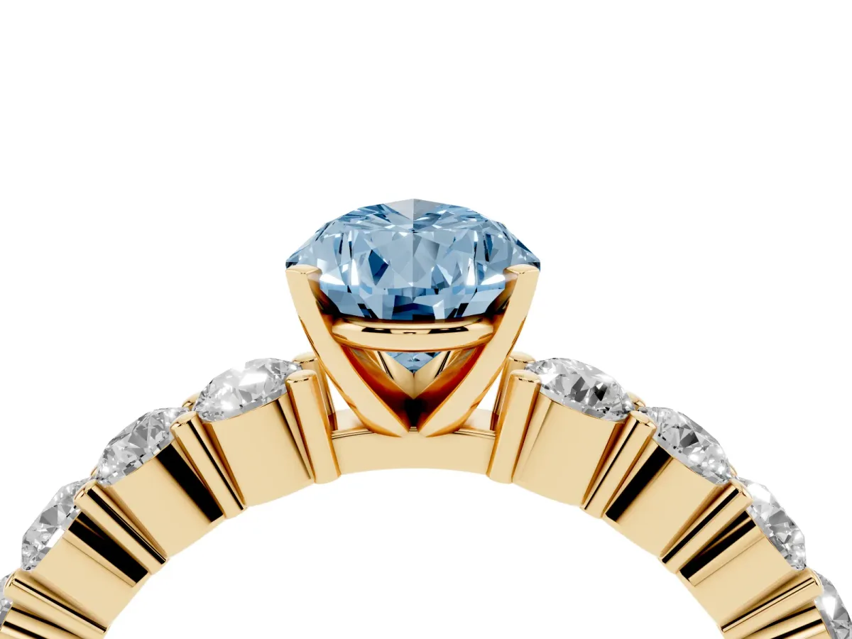 Fancy Blue Pear Cut Diamond Solitaire Ring with Shared Prong Round Side Stones Yellow gold