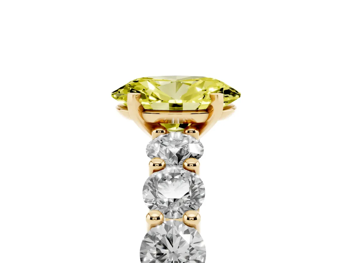 Fancy Yellow Oval Cut Diamond Prong Setting with Side Stones on a Pave Band Yellow gold