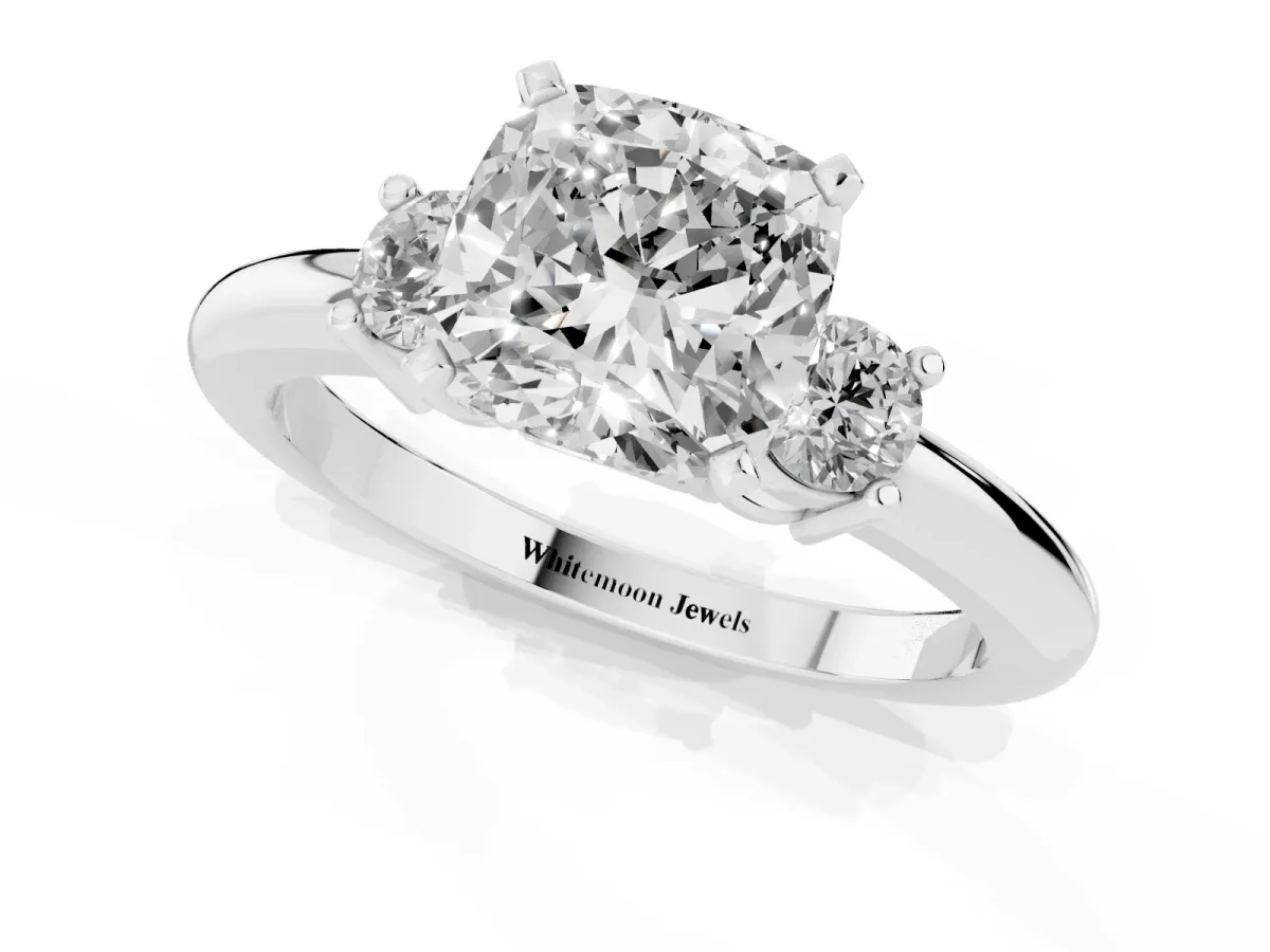 Three-Stone Cushion Cut Cut Diamond Solitaire with Prong Setting and Classic Band Platinum