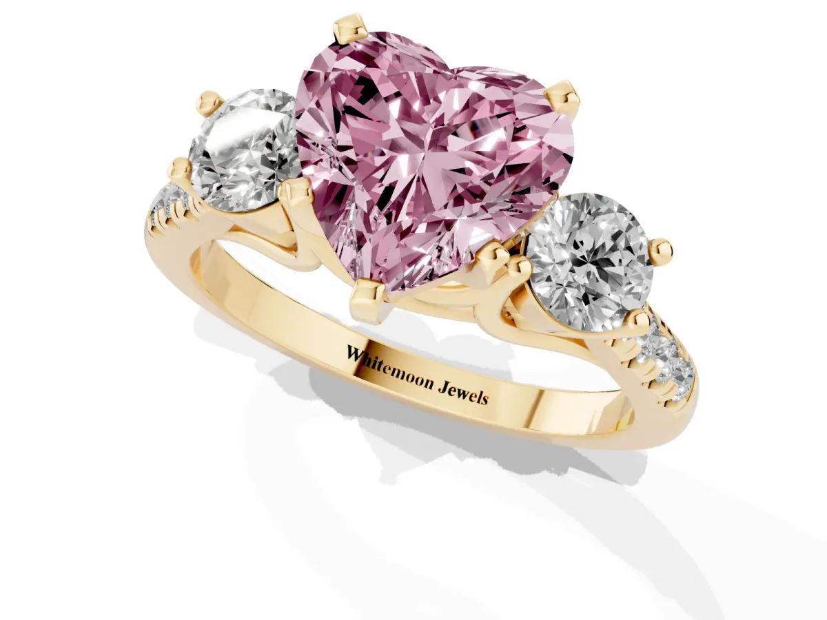 Fancy Pink Three-Stone Heart Cut Diamond Pavé Band with Four-Prong Setting Yellow gold