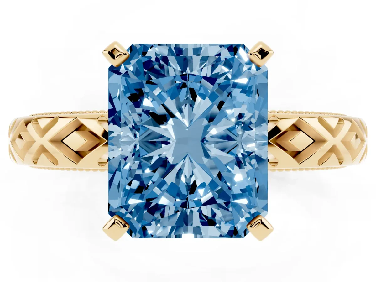 Fancy Blue Radiant Cut Solitaire Diamond Ring with Milgrain and Black Enamel X Pattern Band Yellow gold