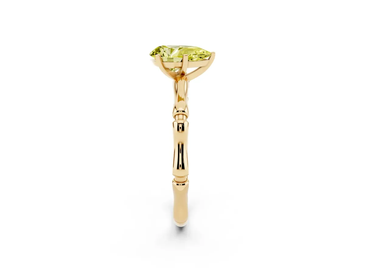 Fancy Yellow Pear Cut Solitaire Diamond Ring with Bamboo Band and Four-Prong Setting Yellow gold