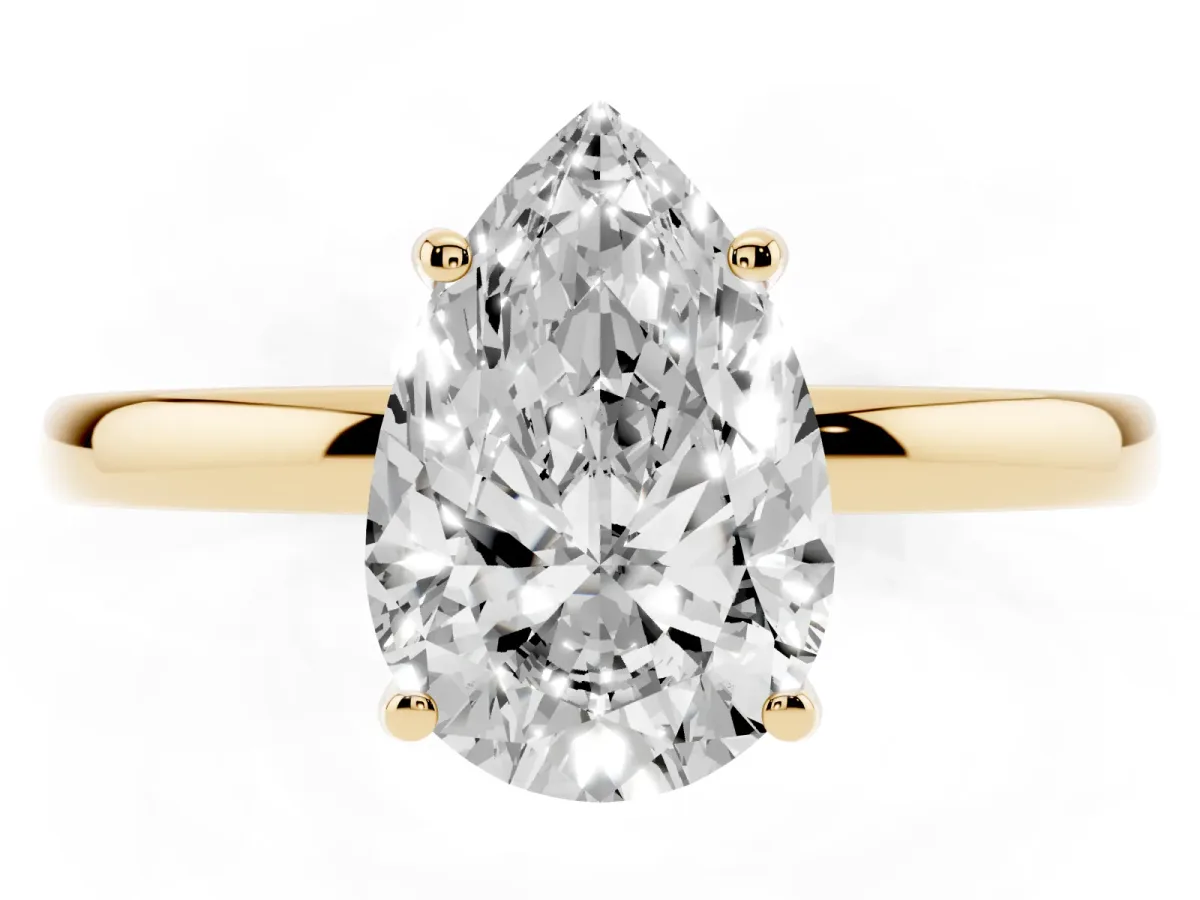 Pear Cut Solitaire Diamond Ring with Prong Setting and Plain Band Yellow gold