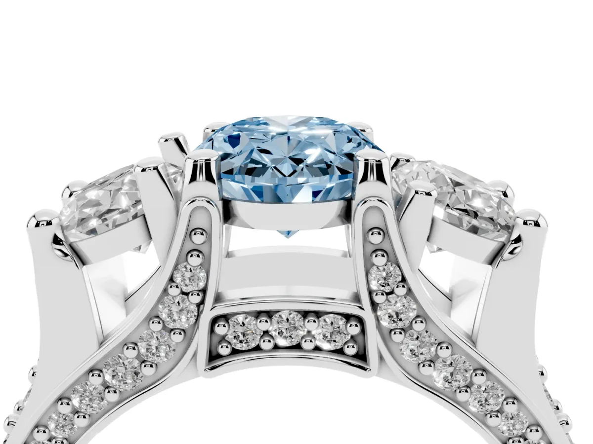 Fancy Blue Oval Cut Diamond Three-Stone Ring with Channel Set Band and Four-Prong Setting Silver