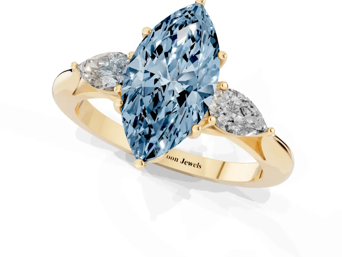 Fancy Blue Marquise Cut Diamond Three-Stone Ring with Pear Side Stones and Prong Setting Yellow gold