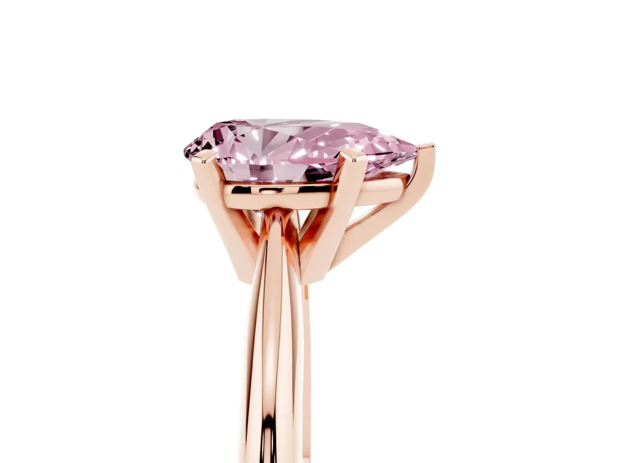 Fancy Pink Pear Cut Cut Solitaire Ring with Four-Prong Setting on a Classic Band Rose gold