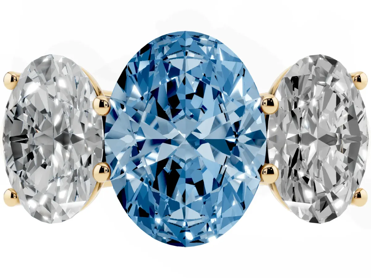 Fancy Blue Oval Cut Three-Stone Diamond Ring with Prong Setting on a Classic Band Yellow gold