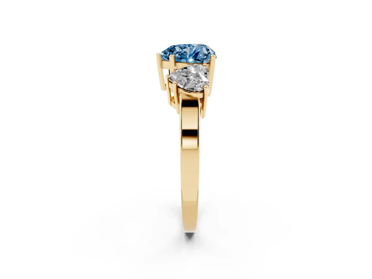 Fancy Blue Three-Stone Heart Cut Cut Diamond Engagement Ring with Flat Band and Four-Prong Setting Yellow gold