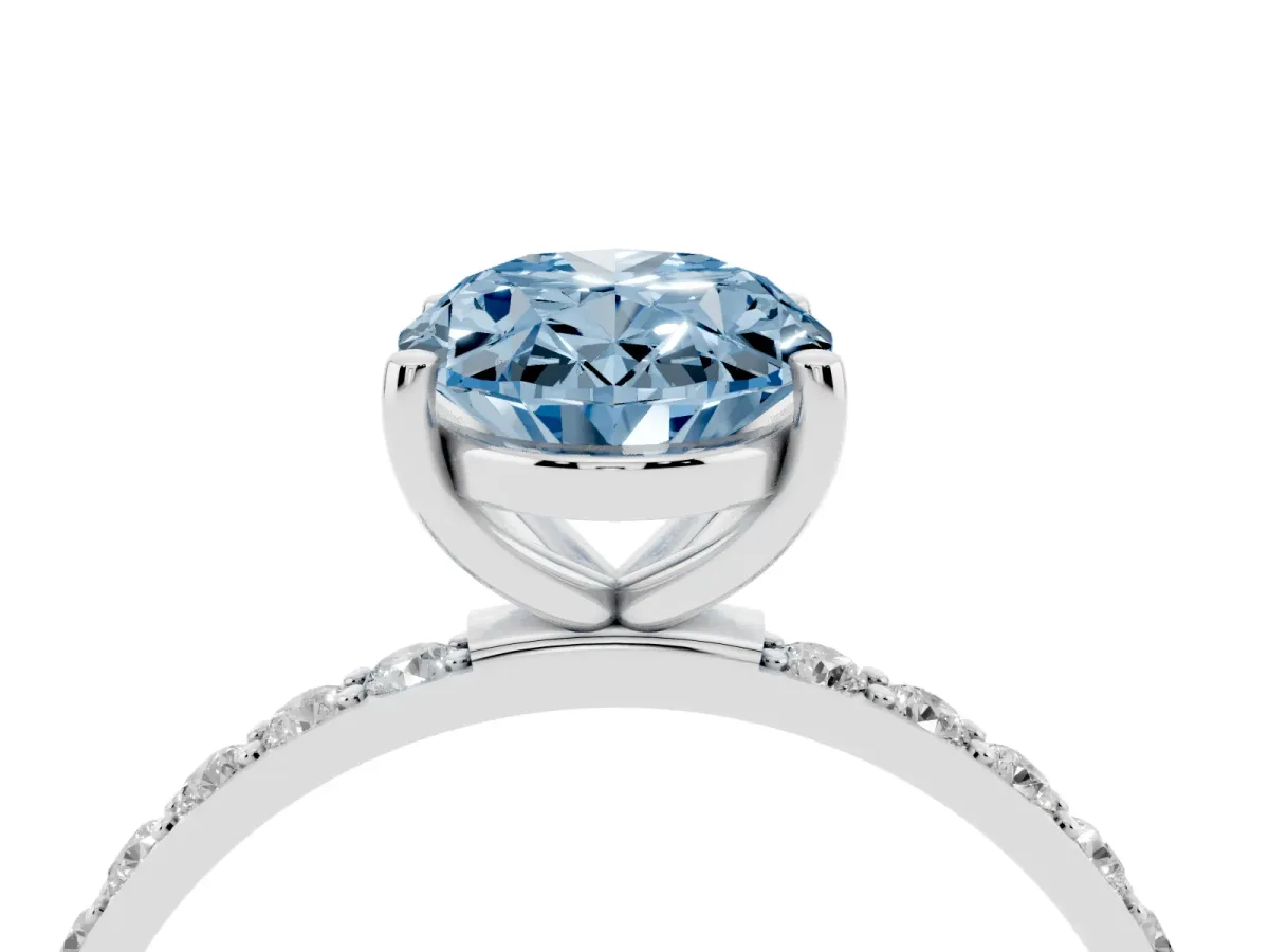 Fancy Blue Oval Cut Diamond Solitaire Ring with Round Pavé Shoulders and Prong Setting Silver