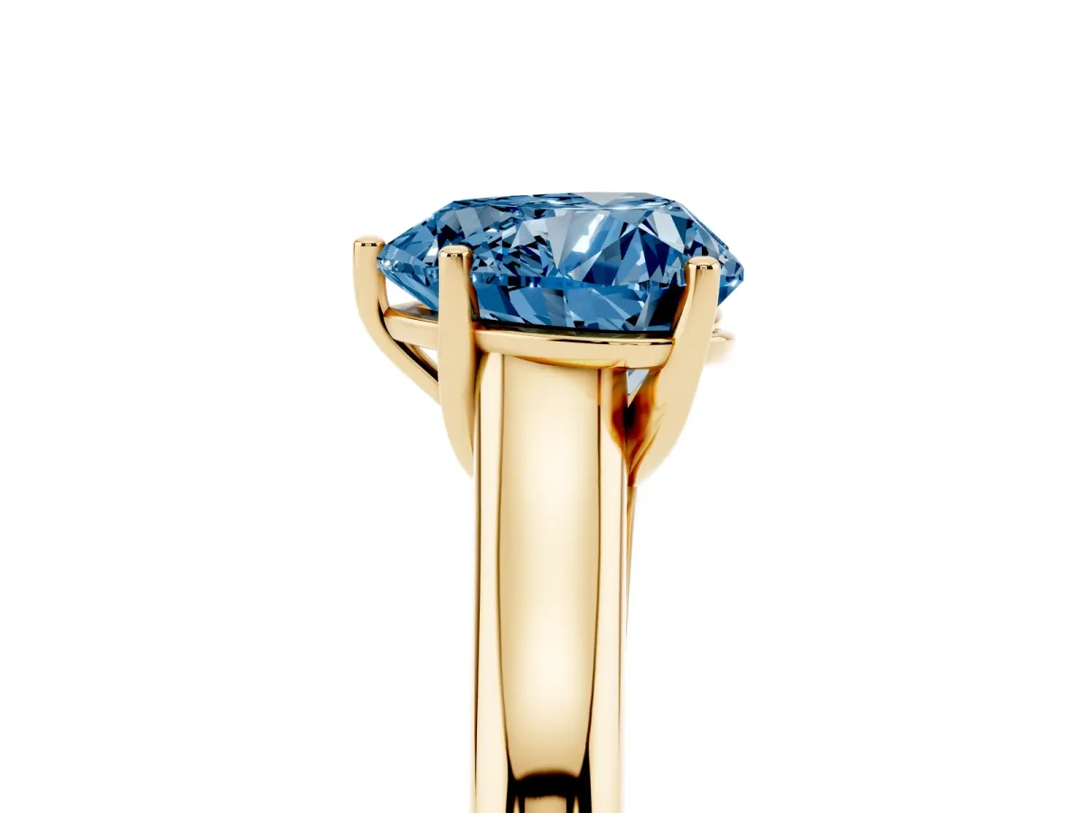 Fancy Blue Heart Cut Cut Diamond Solitaire Engagement Ring with Tapered Plain Band and Four-Prong Setting Yellow gold
