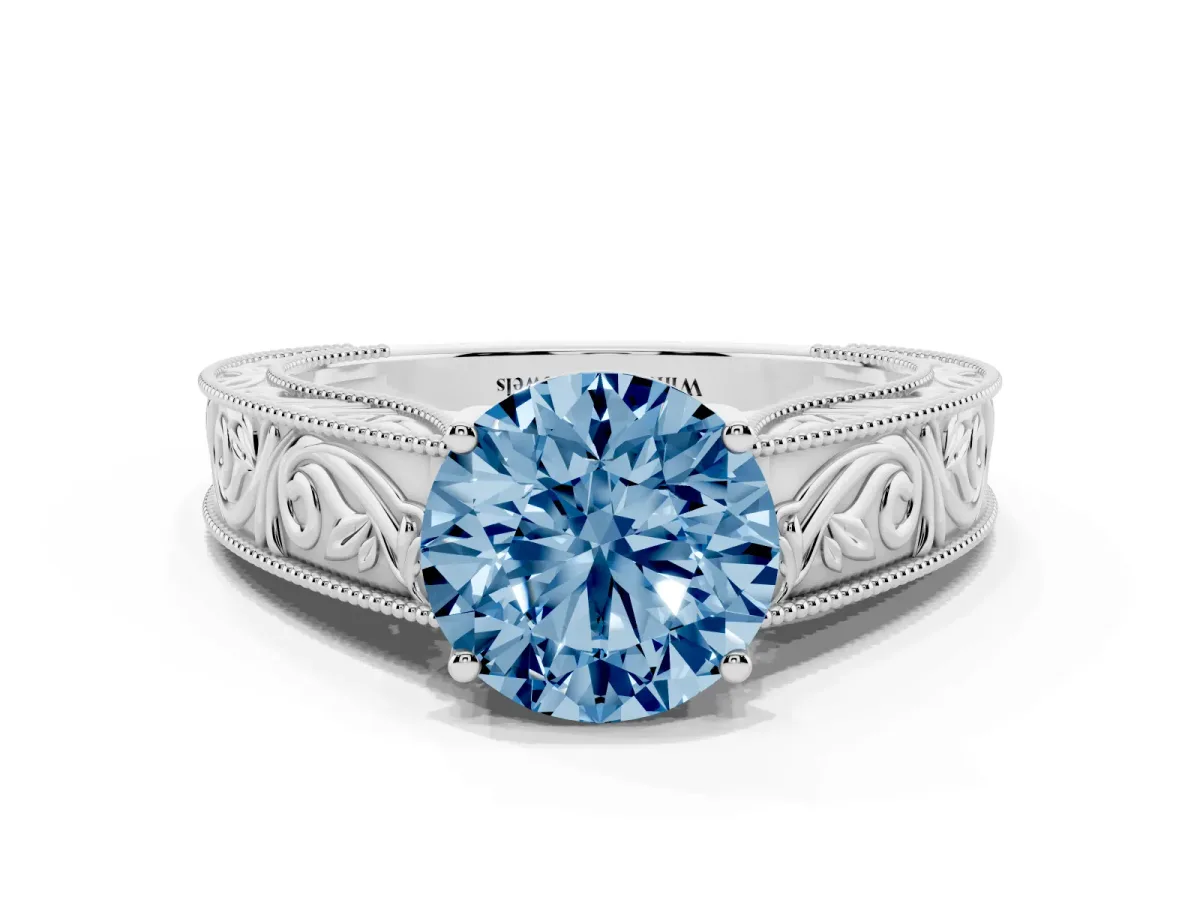 Fancy Blue Round Cut Diamond Solitaire Ring with Engraved Band and Four-Prong Setting White gold