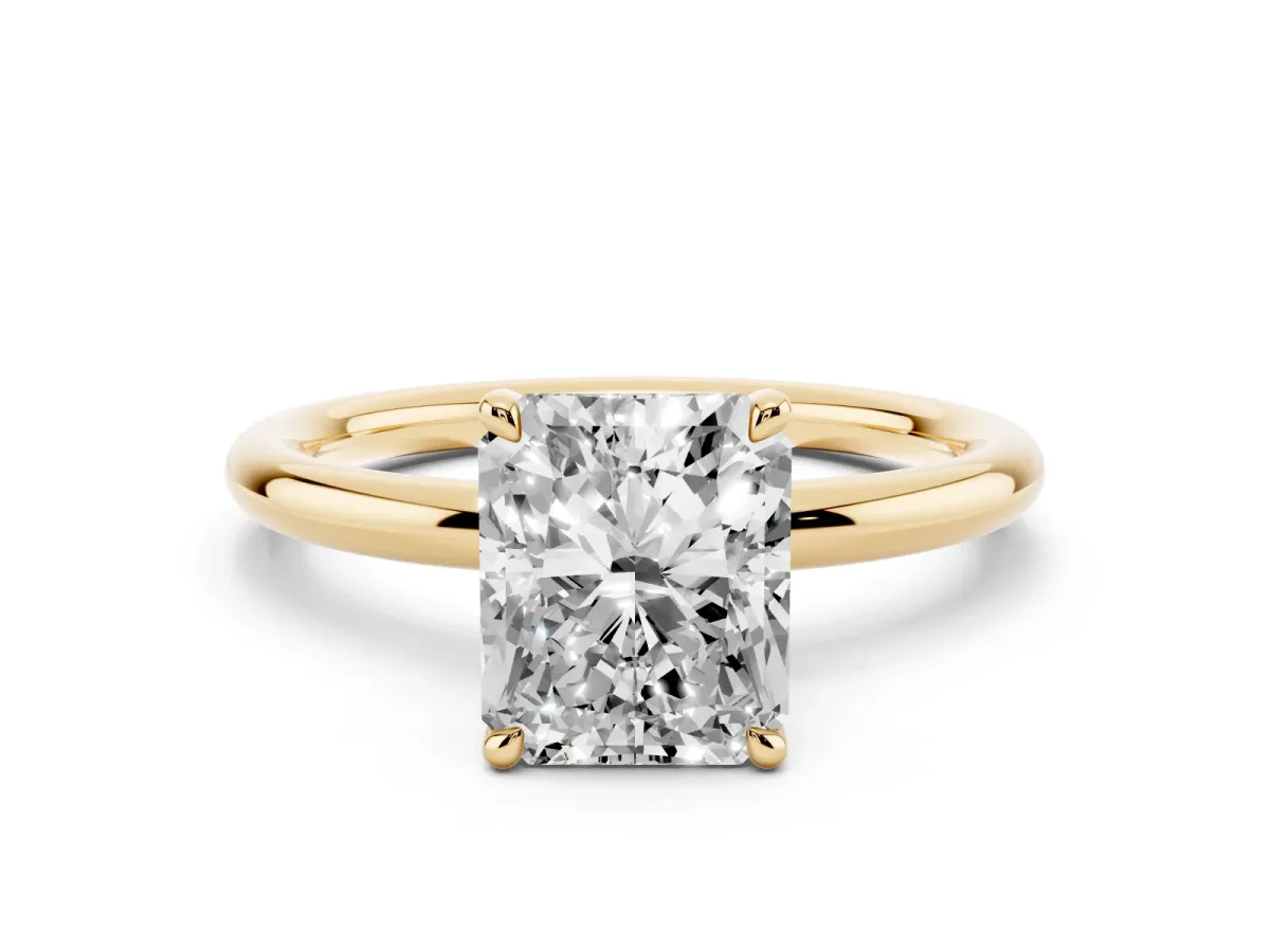 Radiant Cut Diamond Solitaire Ring with Thin Band and Four-Prong Setting Yellow gold