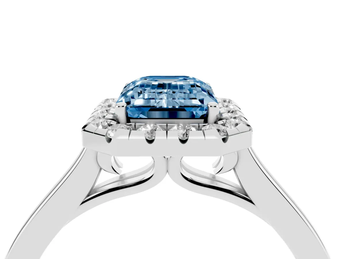 Fancy Blue Emerald Cut Halo Round Diamond Solitaire Ring with Pavé Band and Four-Prong Setting Silver