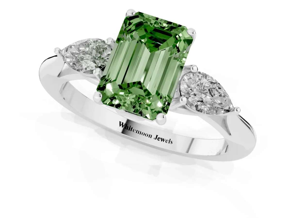 Fancy Green Three-Stone Emerald Cut Diamond Ring with Pear Side Stones in Four-Prong Setting Silver