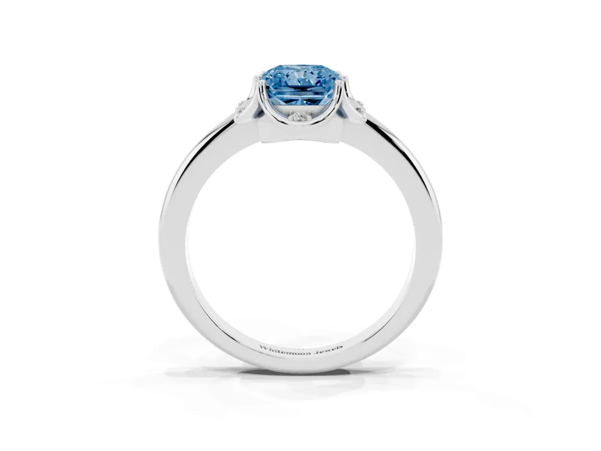 Fancy Blue Radiant Cut Halo Diamond Ring with Round Cluster Setting, Solitaire Band, and Four-Prong Setting Platinum