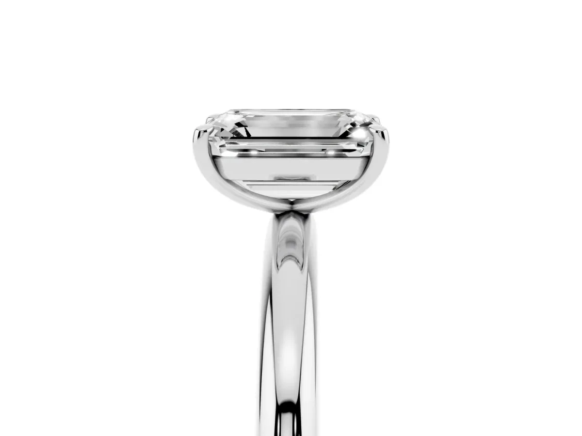 Emerald Cut Solitaire Diamond Ring with Four-Prong Setting on a Plain Band Platinum
