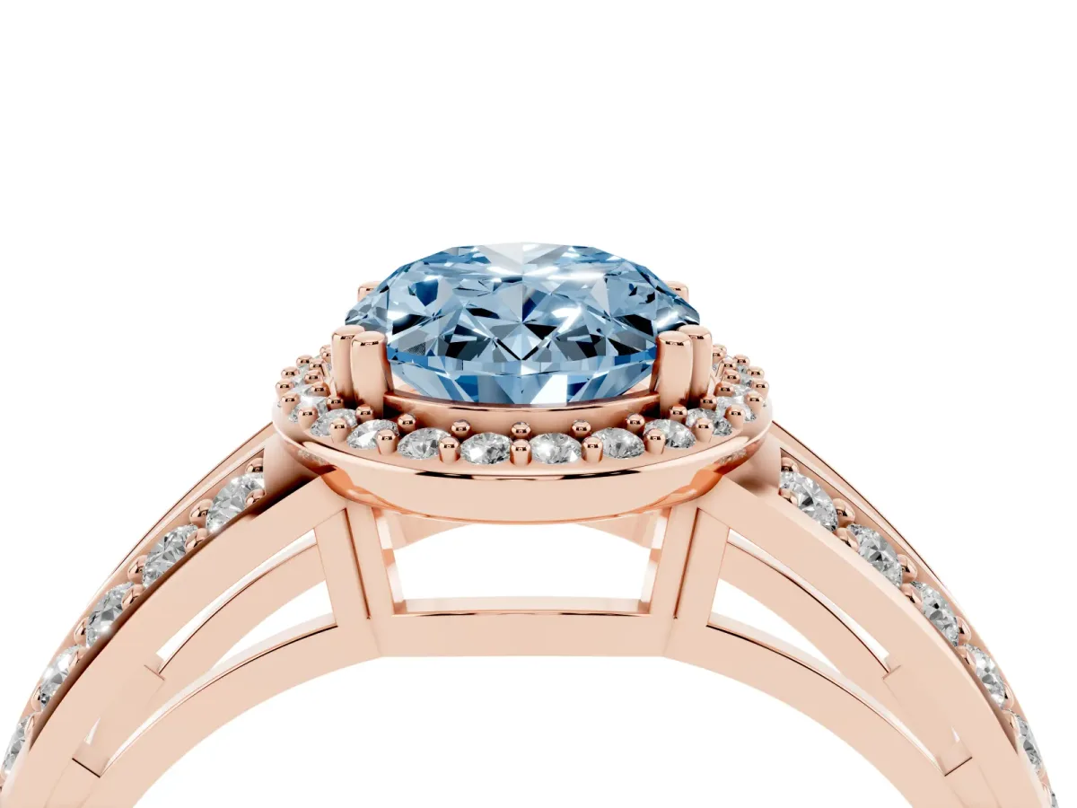 Fancy Blue Oval Cut Diamond Halo Ring with Split Shank Pavé Band and Four-Prong Setting Rose gold