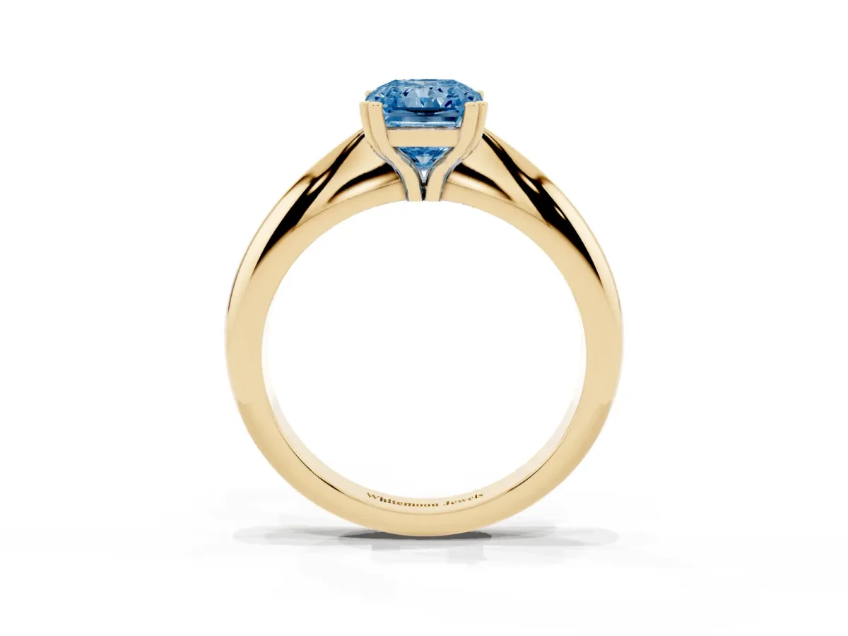 Fancy Blue Radiant Cut Cut Solitaire Engagement Ring with Tapered Band and Four-Prong Setting Yellow gold