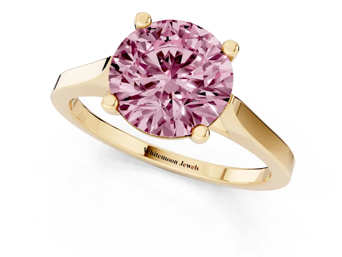 Fancy Pink Round Cut Solitaire Diamond Ring with Four-Prong Setting and Tapered Band Yellow gold