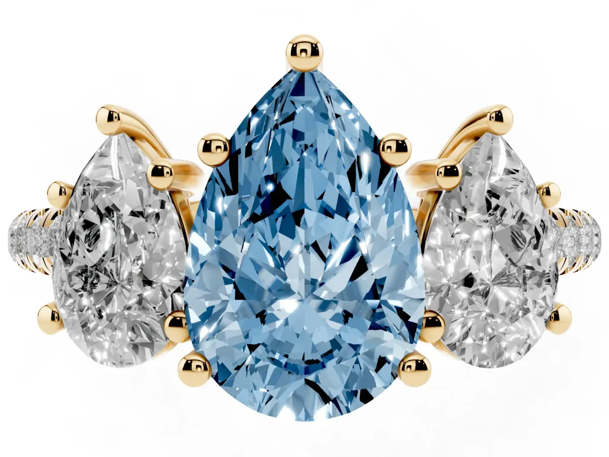 Fancy Blue Three-Stone Pear Cut Diamond Ring with Round Pavé Band and Prong Setting Yellow gold