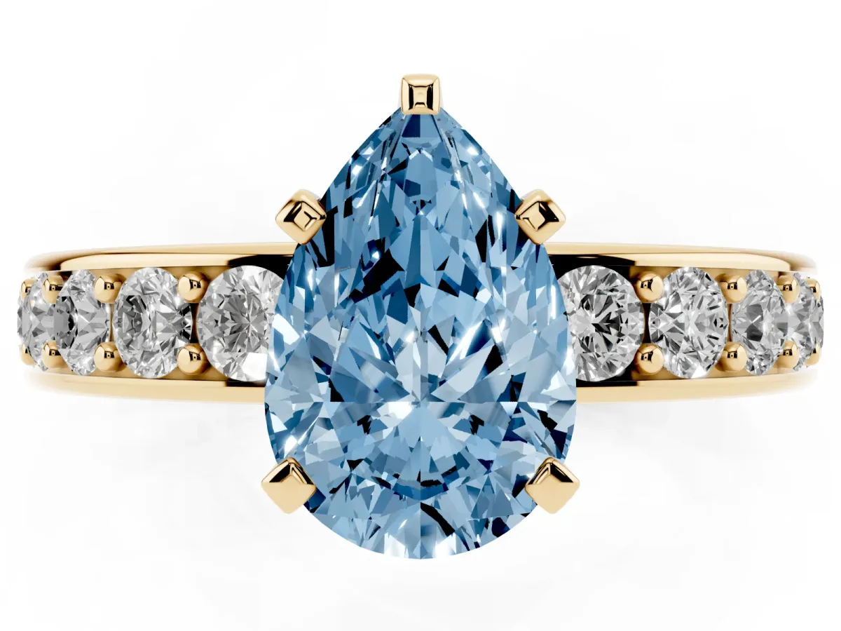 Fancy Blue Pear Cut Diamond Engagement Ring with Channel Set Round Band and Prong Setting Yellow gold