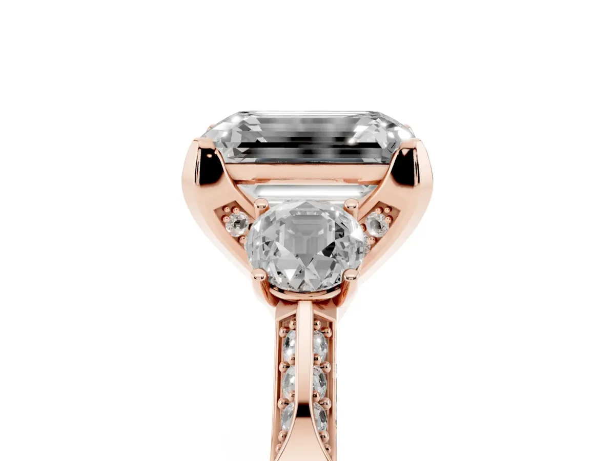Fancy Pink Emerald Cut Brilliant Three-Stone Diamond Ring with Pavé Band and Four-Prong Setting Rose gold