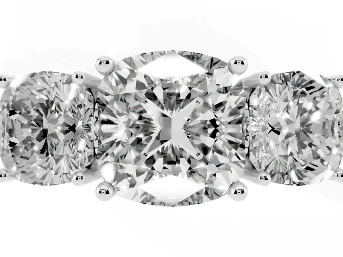 Three-Stone Cushion Cut Cut Diamond Engagement Ring with Prong Setting on a White Gold Band White gold