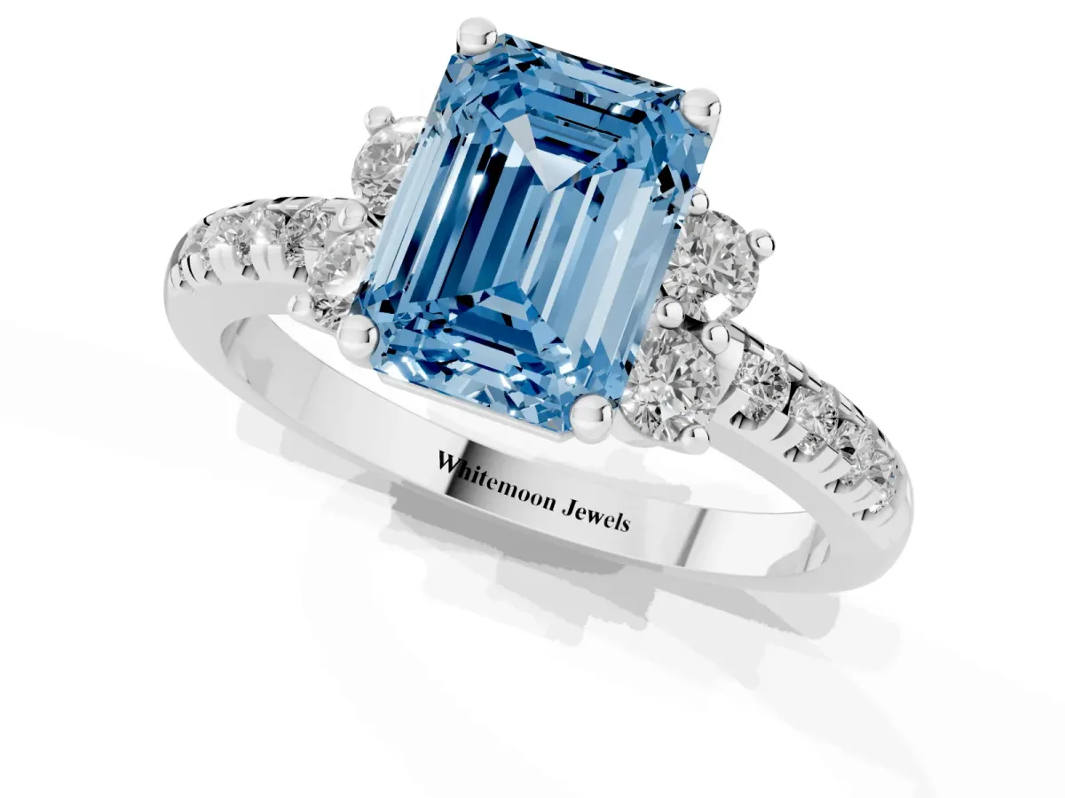 Fancy Blue Emerald Cut Diamond Three-Stone Pave Band with Four-Prong Setting Platinum