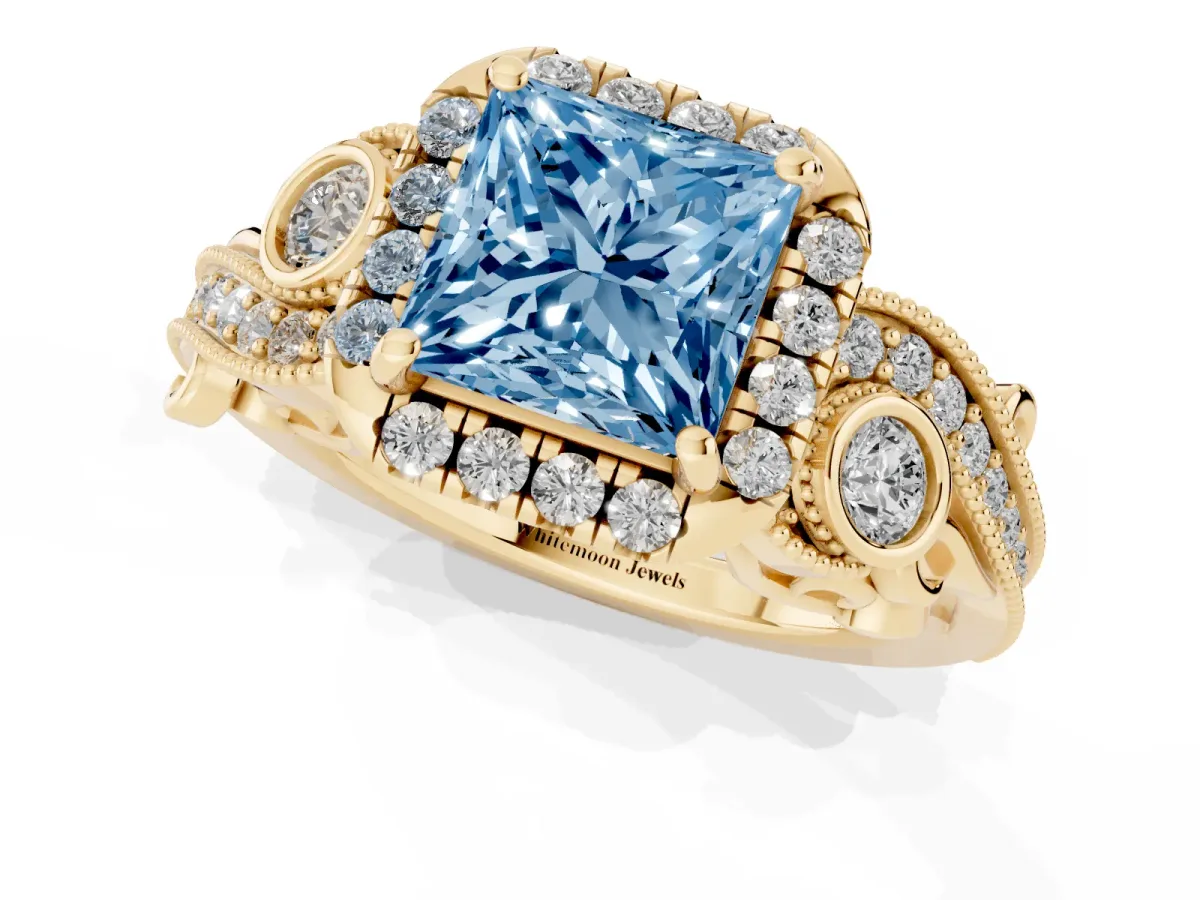 Fancy Blue Princess Cut Diamond Halo Ring with Milgrain Pavé Band and Four-Prong Setting Yellow gold