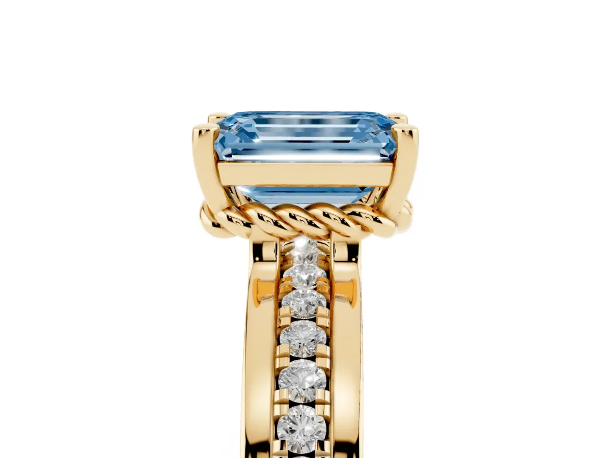 Fancy Blue Emerald Cut Solitaire Diamond Ring with Channel Set Band and Six-Prong Setting Yellow gold