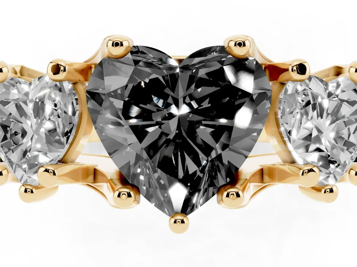 Fancy Black Heart Cut Diamond Three-Stone Ring with Channel Set Band and Four-Prong Setting Yellow gold