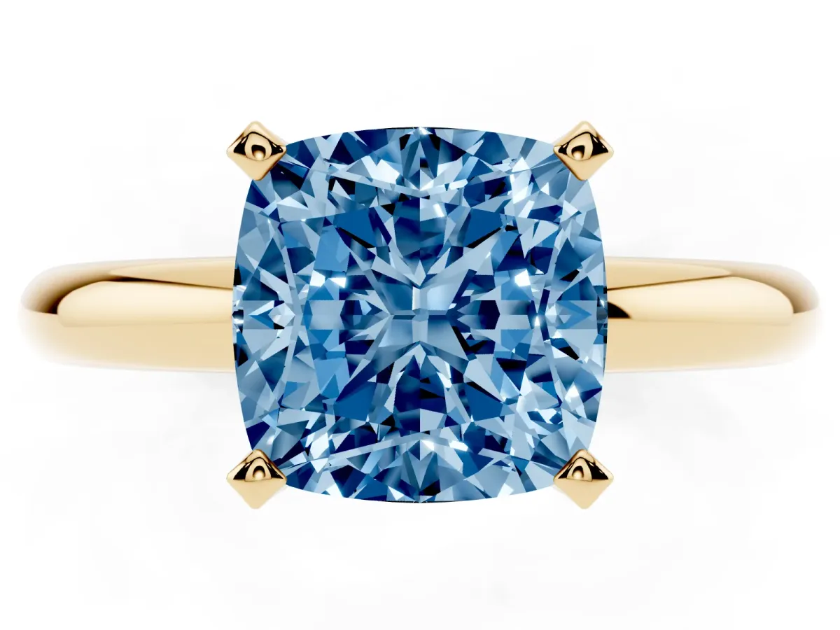 Fancy Blue Cushion Cut Diamond Solitaire Engagement Ring with Round Band and Four-Prong Setting Yellow gold