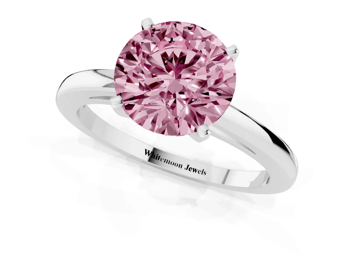 Fancy Pink Round Cut Solitaire Diamond Engagement Ring with Four-Prong Setting on a Classic Band Platinum