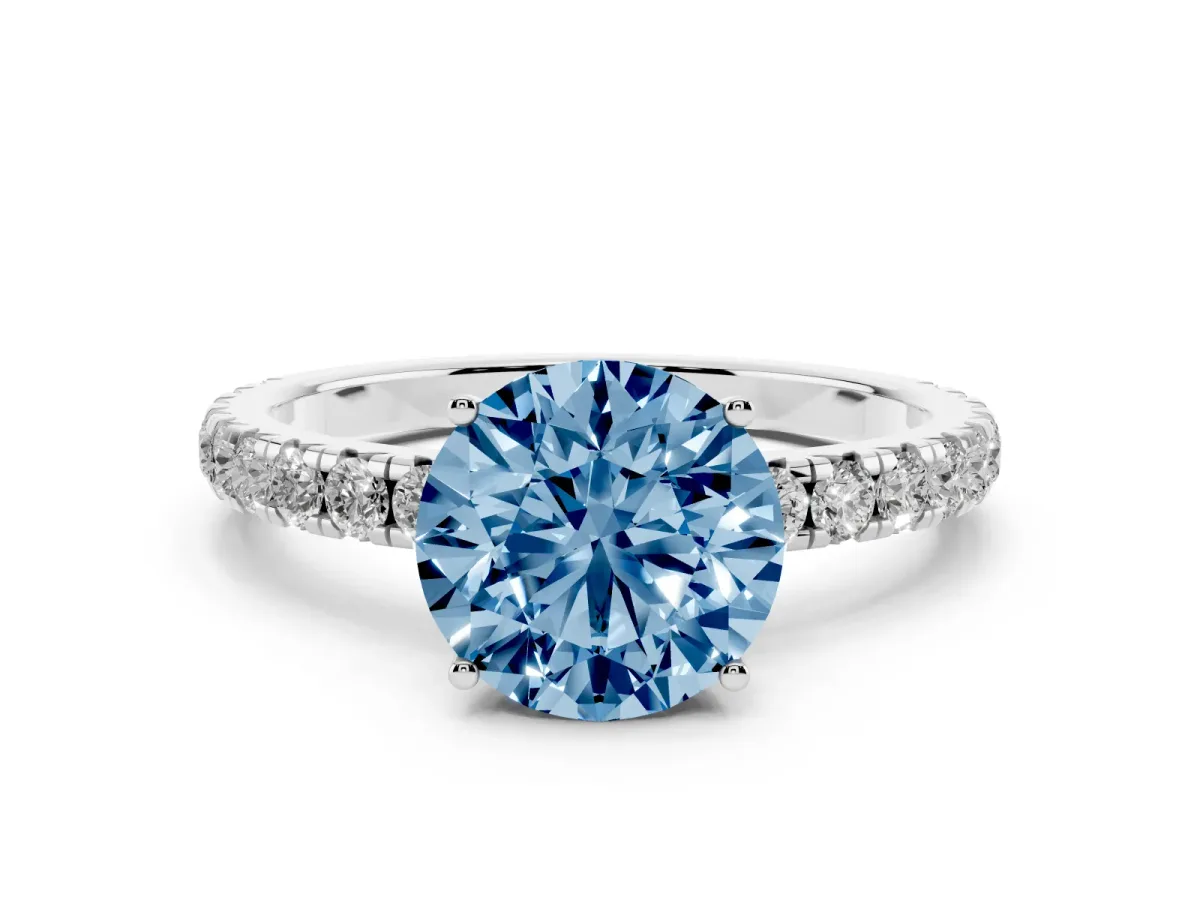 Fancy Blue Round Cut Diamond Pavé Solitaire Engagement Ring with Four-Prong Setting Silver