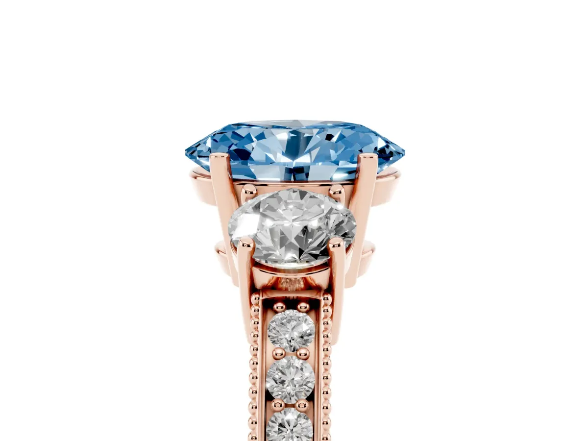 Fancy Blue Oval Cut Three-Stone Diamond Ring with Pavé Band and Four-Prong Setting Rose gold