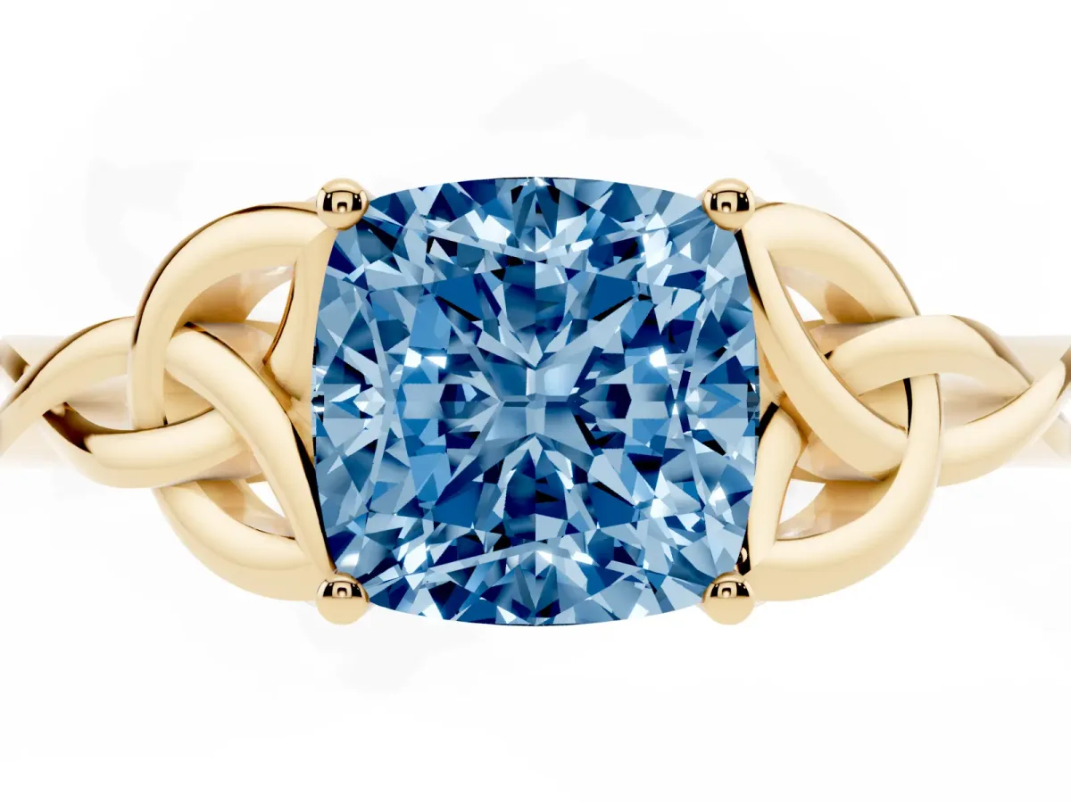 Fancy Blue Cushion Cut Diamond Solitaire Engagement Ring with Celtic Knot Band and Four-Prong Setting Yellow gold