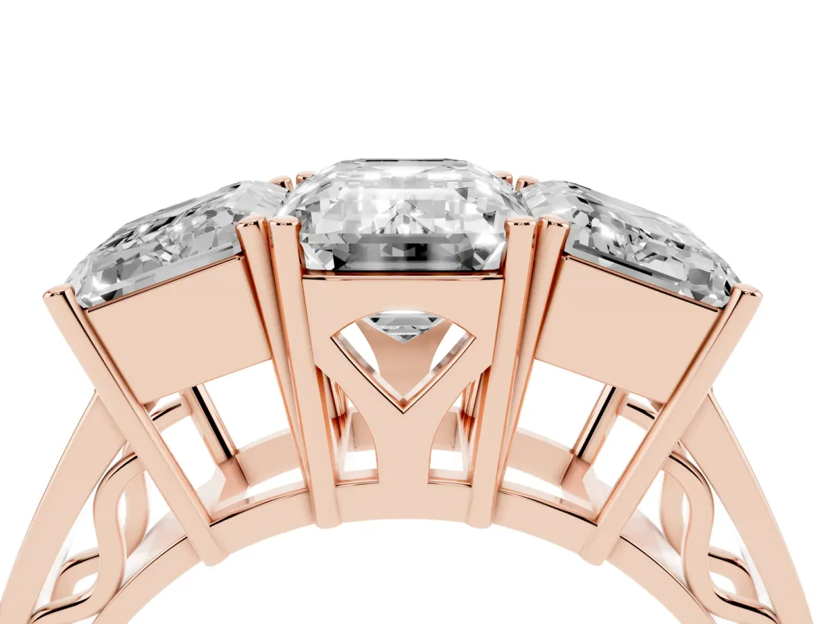 Emerald Cut Diamond Three-Stone Ring with Prong Setting and Textured Band Rose gold