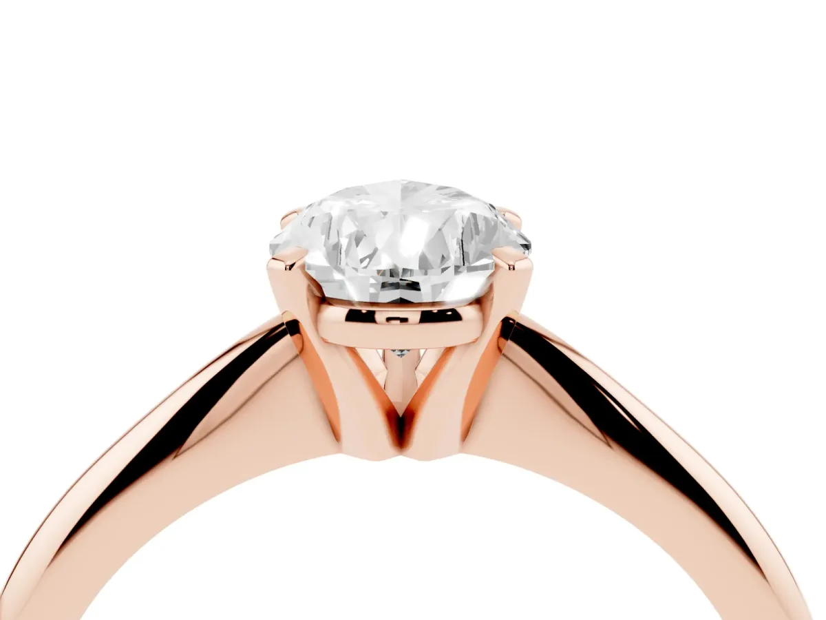 Pear Cut Cut Solitaire Ring with Four-Prong Setting on a Classic Band Rose gold