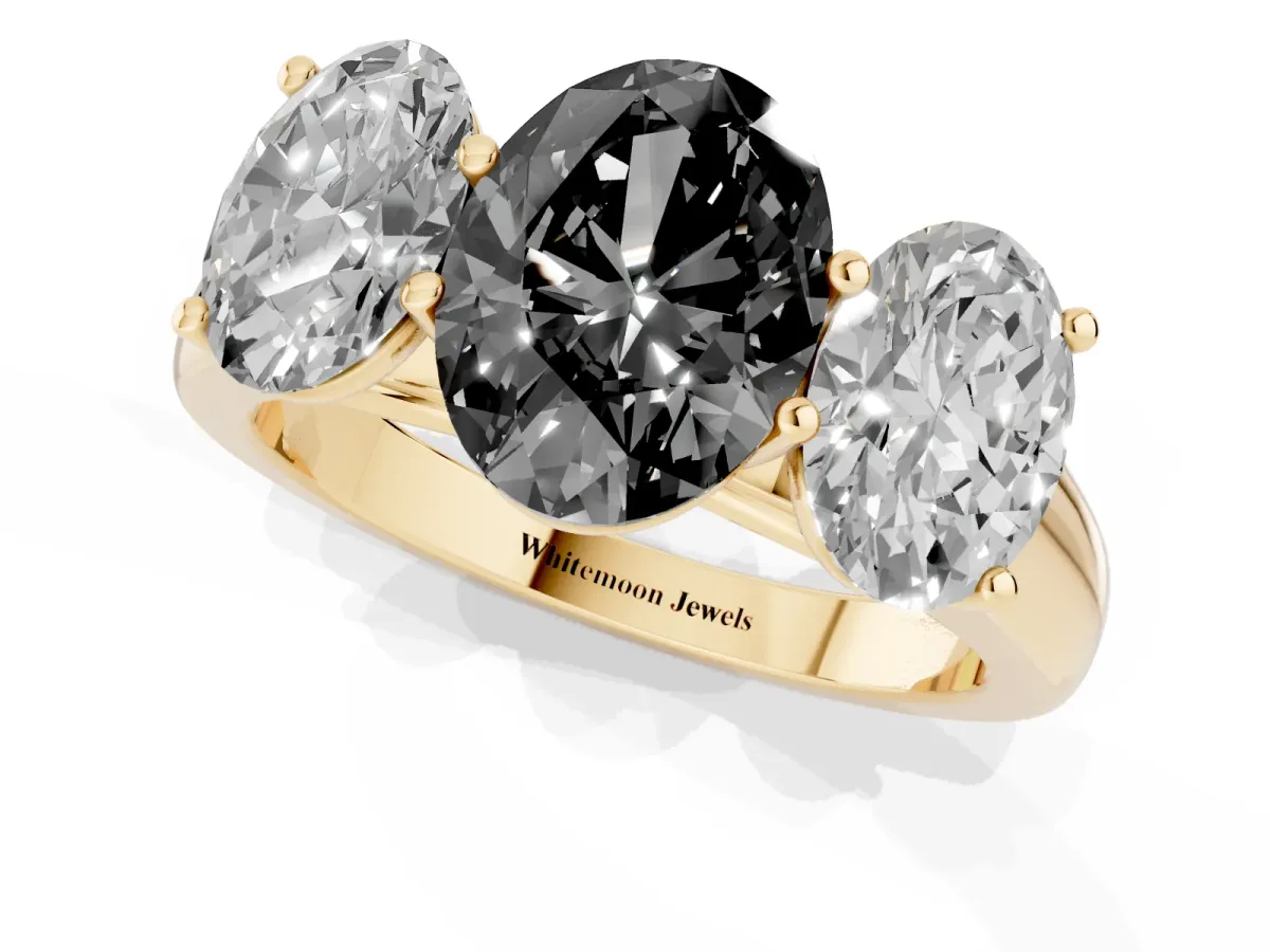 Fancy Black Oval Cut Three-Stone Diamond Ring with Prong Setting on a Classic Band Yellow gold