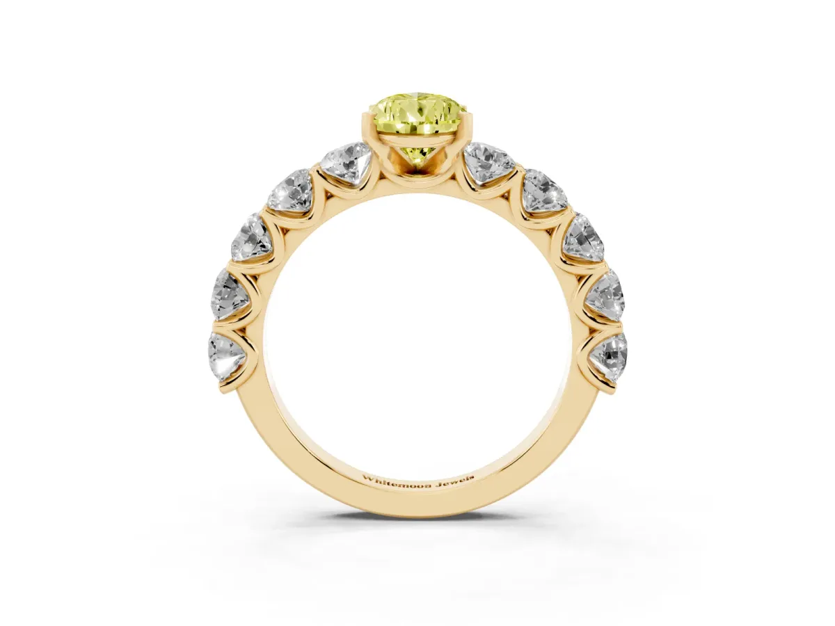Fancy Yellow Pear Cut Diamond Prong Setting with Side Stones on a Pave Band Yellow gold
