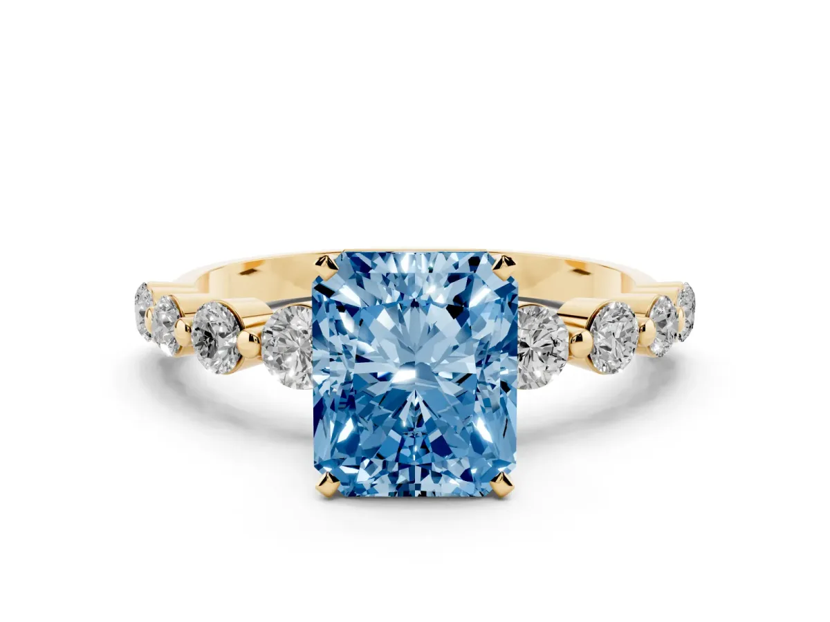 Fancy Blue Radiant Cut Solitaire Diamond Ring with Pave Band and Four-Prong Setting Yellow gold