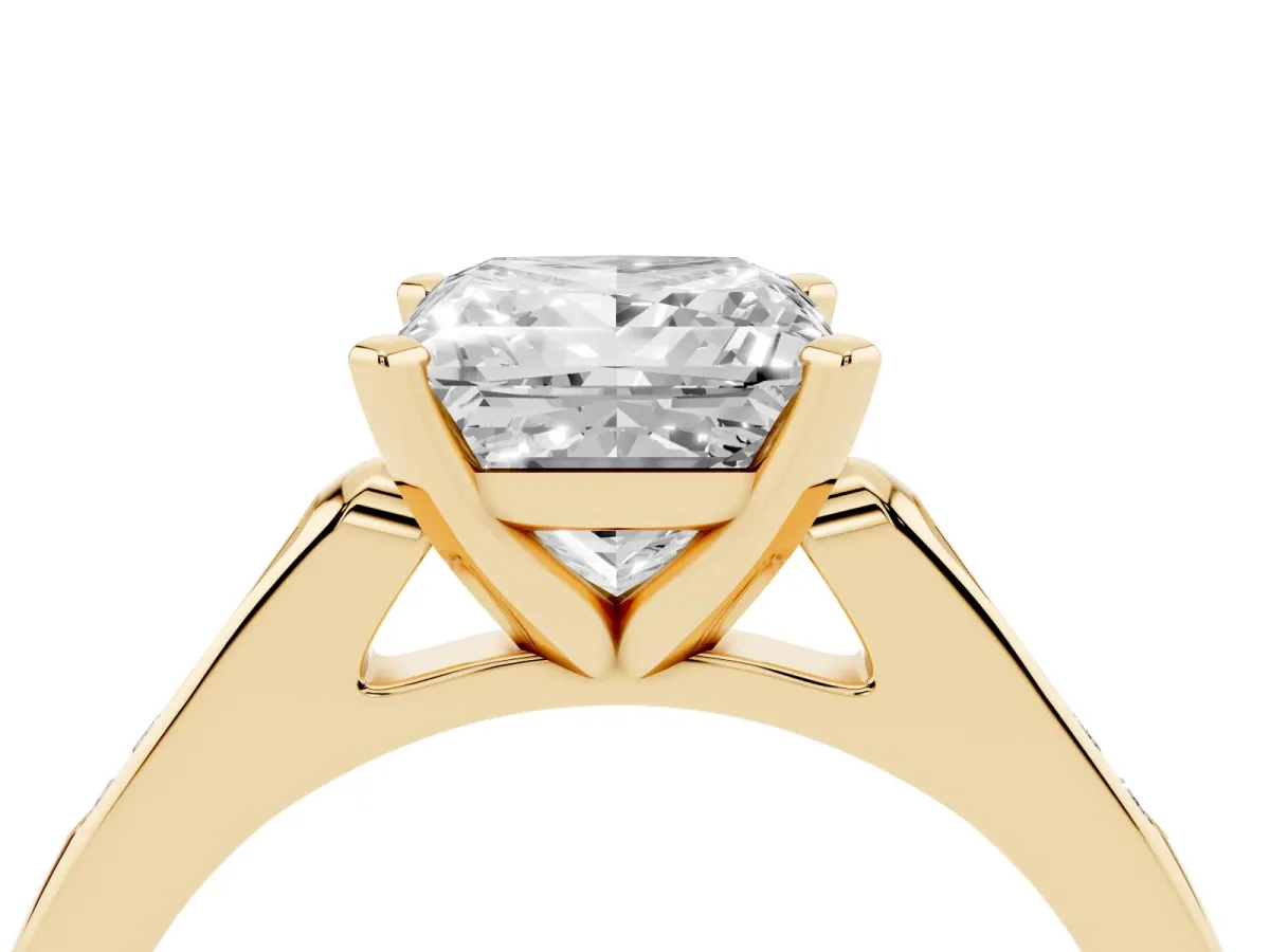 Princess Cut Diamond Solitaire Ring with Channel Set Round Band and Prong Setting Yellow gold
