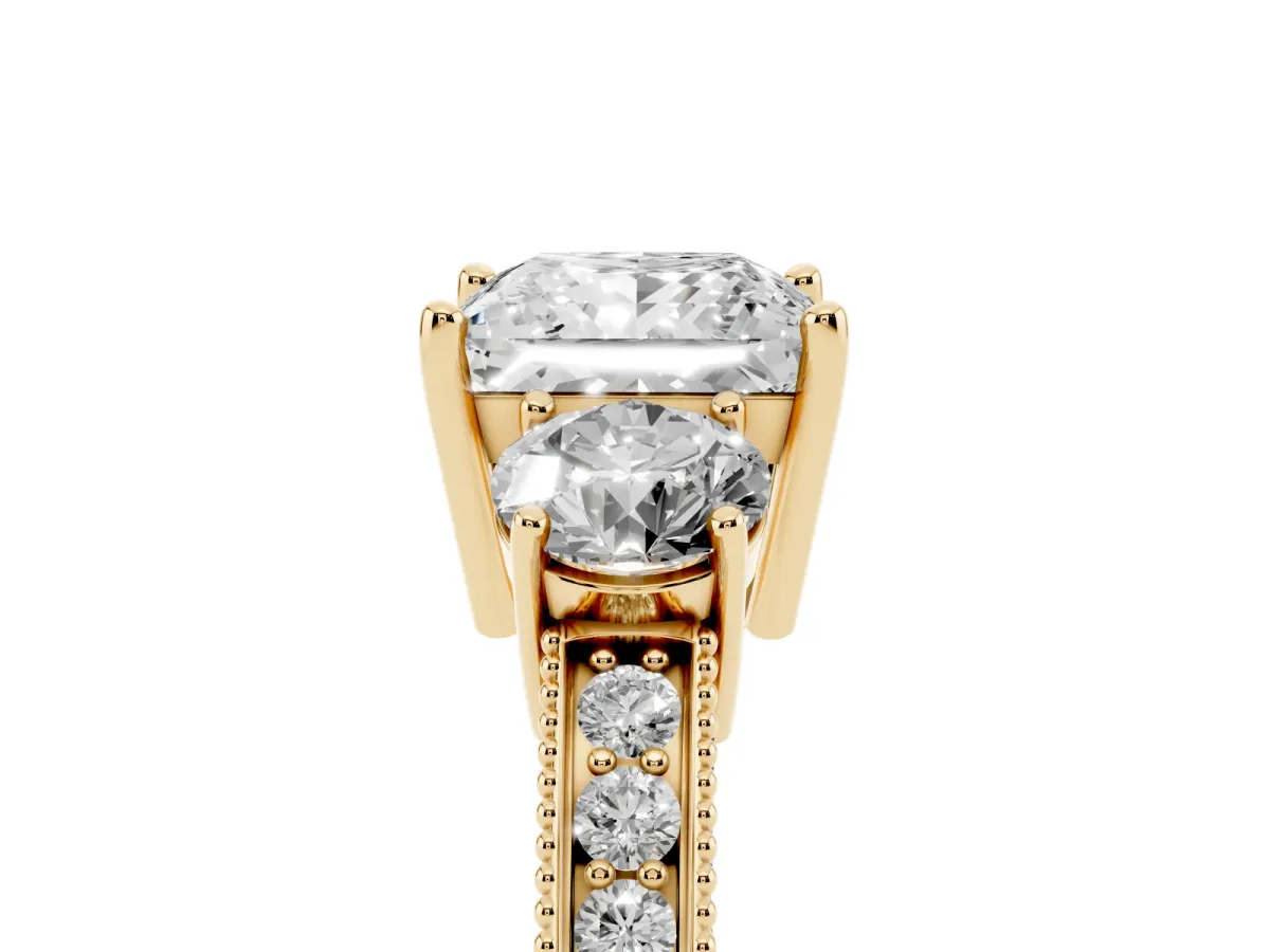 Princess Cut Three-Stone Diamond Ring with Pavé Band and Four-Prong Setting Yellow gold
