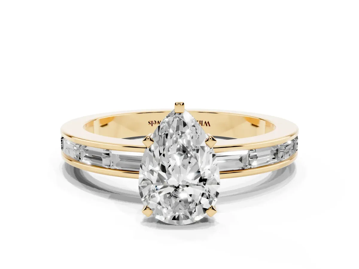 Pear Cut Solitaire Diamond Ring with Channel-Set Baguette Band and Four-Prong Setting Yellow gold