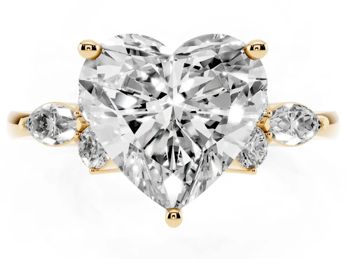 Heart Cut Brilliant Diamond Solitaire Ring with Pear Side Stones and Four-Prong Setting Yellow gold