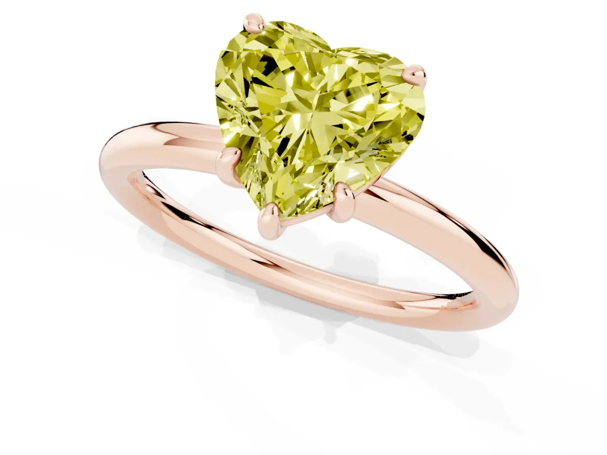 Fancy Yellow Heart Cut Solitaire Diamond Ring with Four-Prong Setting on a Plain Band Rose gold
